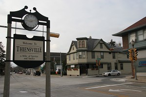 Downtown Thiensville with "Welcome to Theinsville" sign